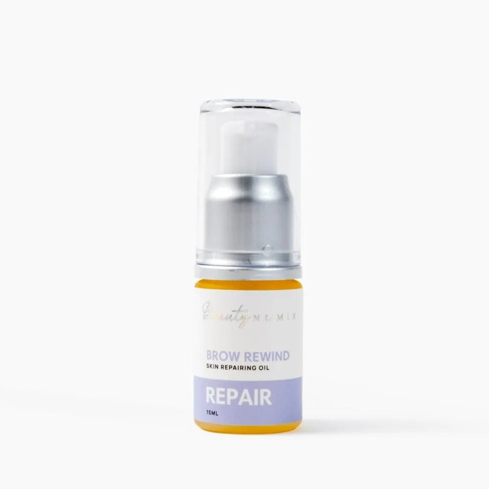 Clear glass bottle of BeautyNomix REPAIR Skin Repairing Oil, 15ml, with silver pump and yellow base.