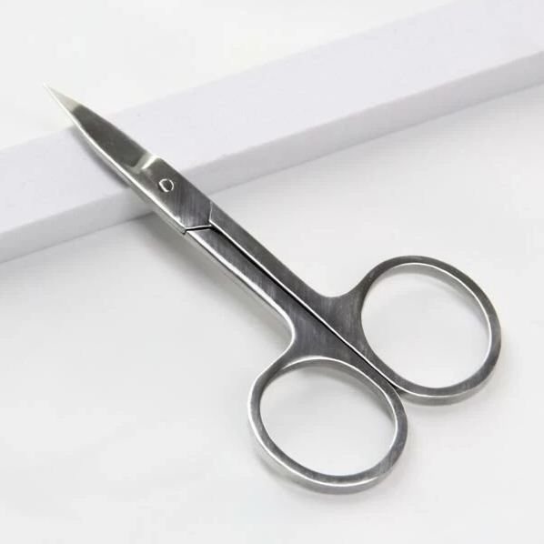 Small stainless steel scissors by BeautyNomix with sharp blades and rounded handles.