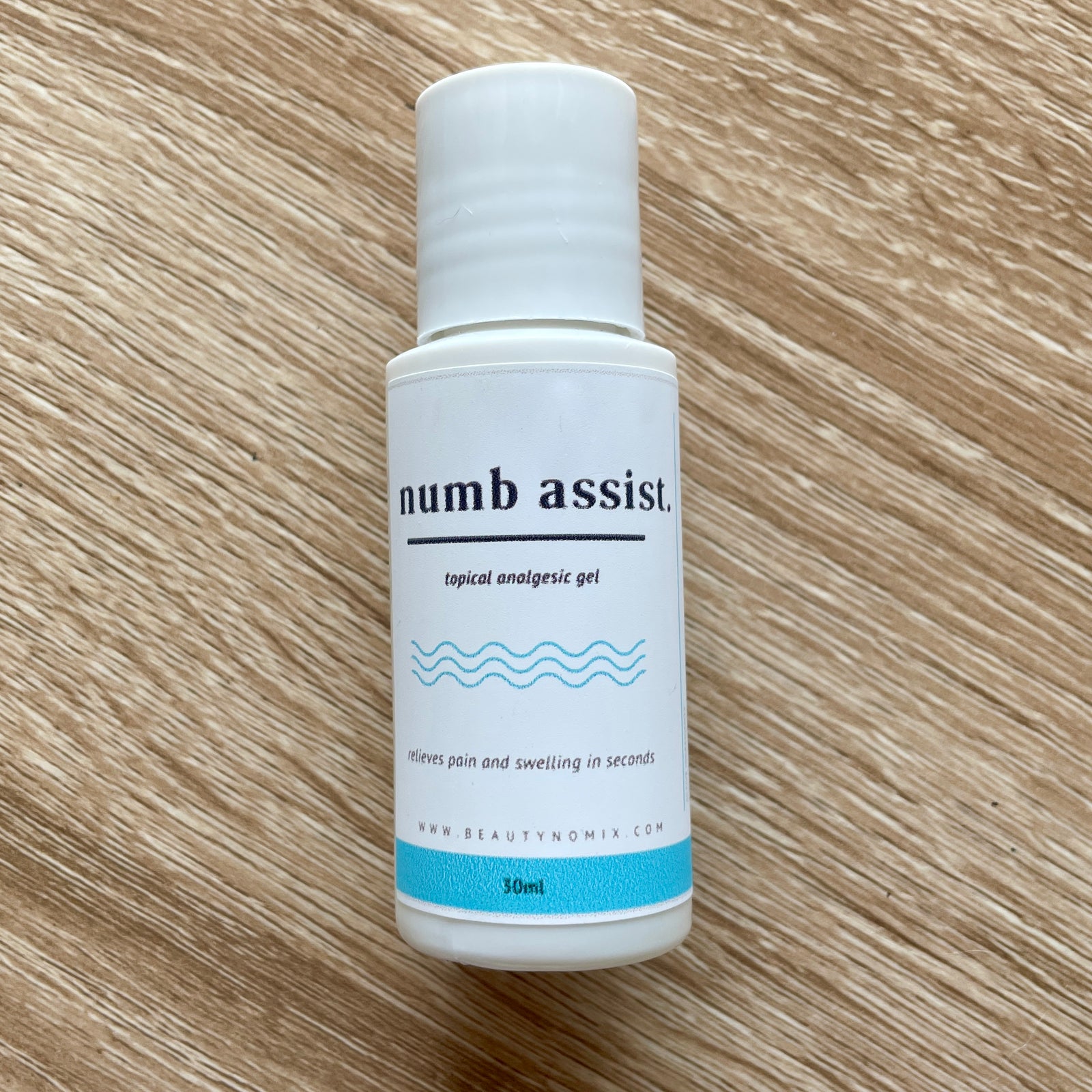 BeautyNomix Numb Assist topical anesthetic numbing gel in a 1 oz bottle, clear gel formula