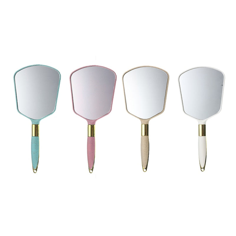 Square handheld makeup mirror in beige by BeautyNomix, lightweight design for easy portability.