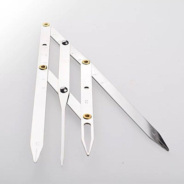 Gold eyebrow measuring caliper by BeautyNomix, ideal for microblading and travel, featuring precise measurement markings.